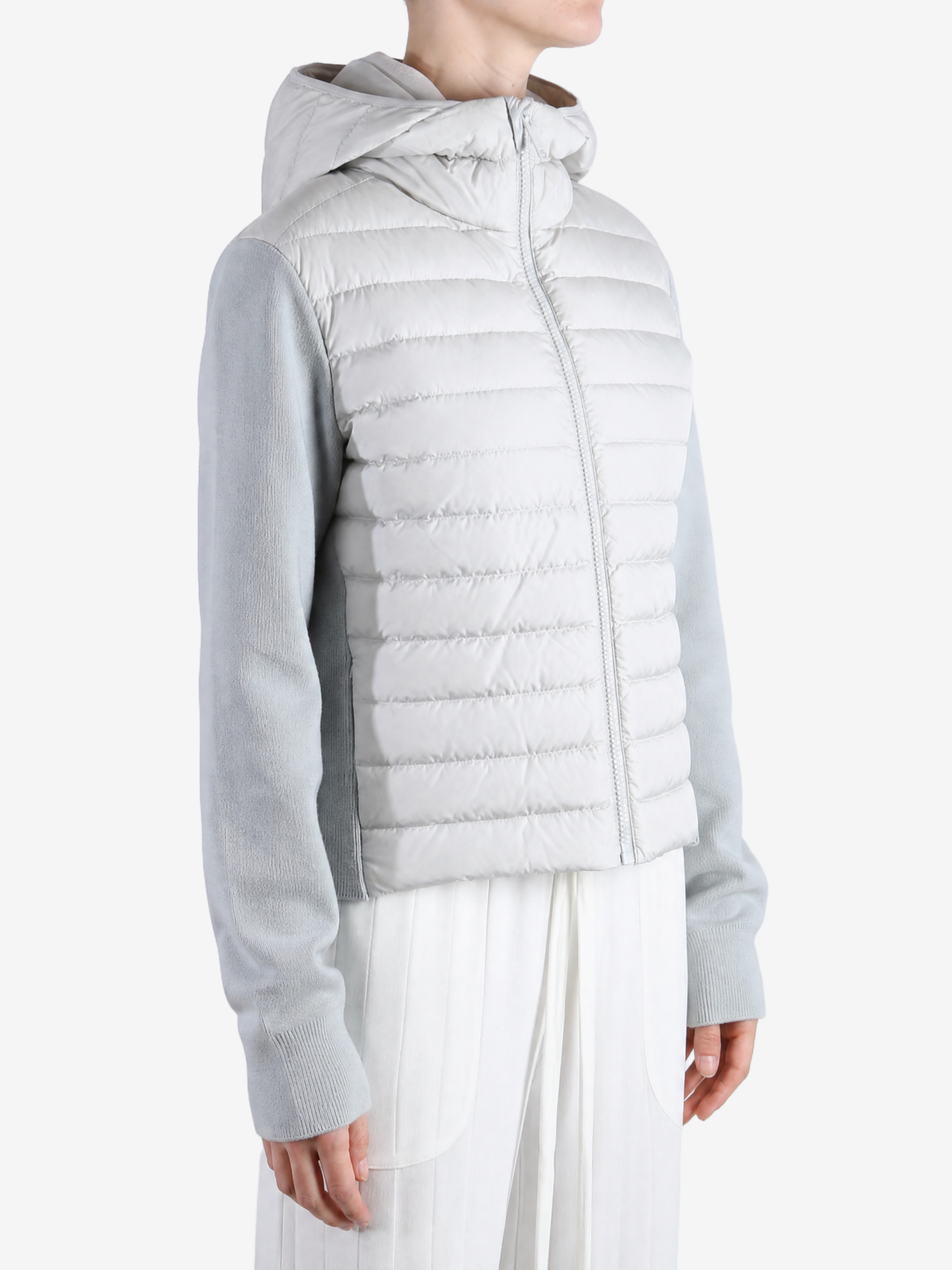White hoodie worn by a person, showing the hoodie fit