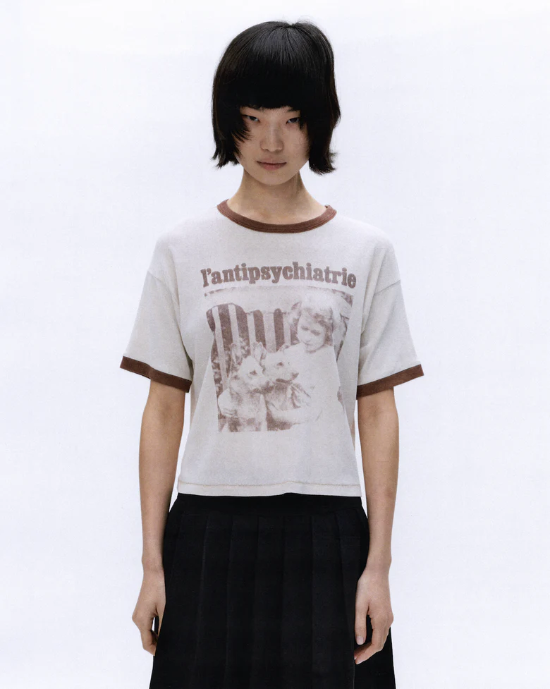 White t-shirt worn by a person, showing the t-shirt's fit