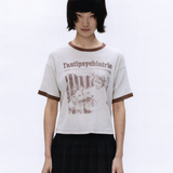 White t-shirt worn by a person, showing the t-shirt's fit