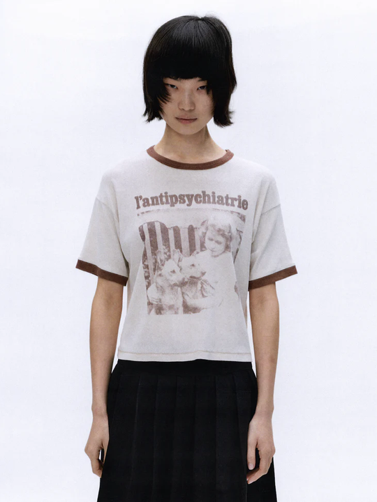 White t-shirt worn by a person, showing the t-shirt's fit