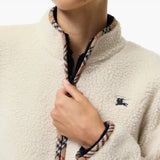 Tan jacket worn by a person, showing the jacket fit