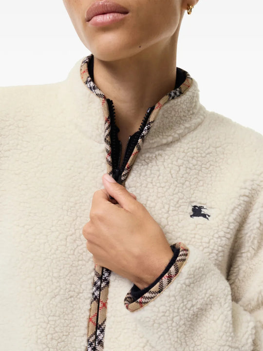 Tan jacket worn by a person, showing the jacket fit