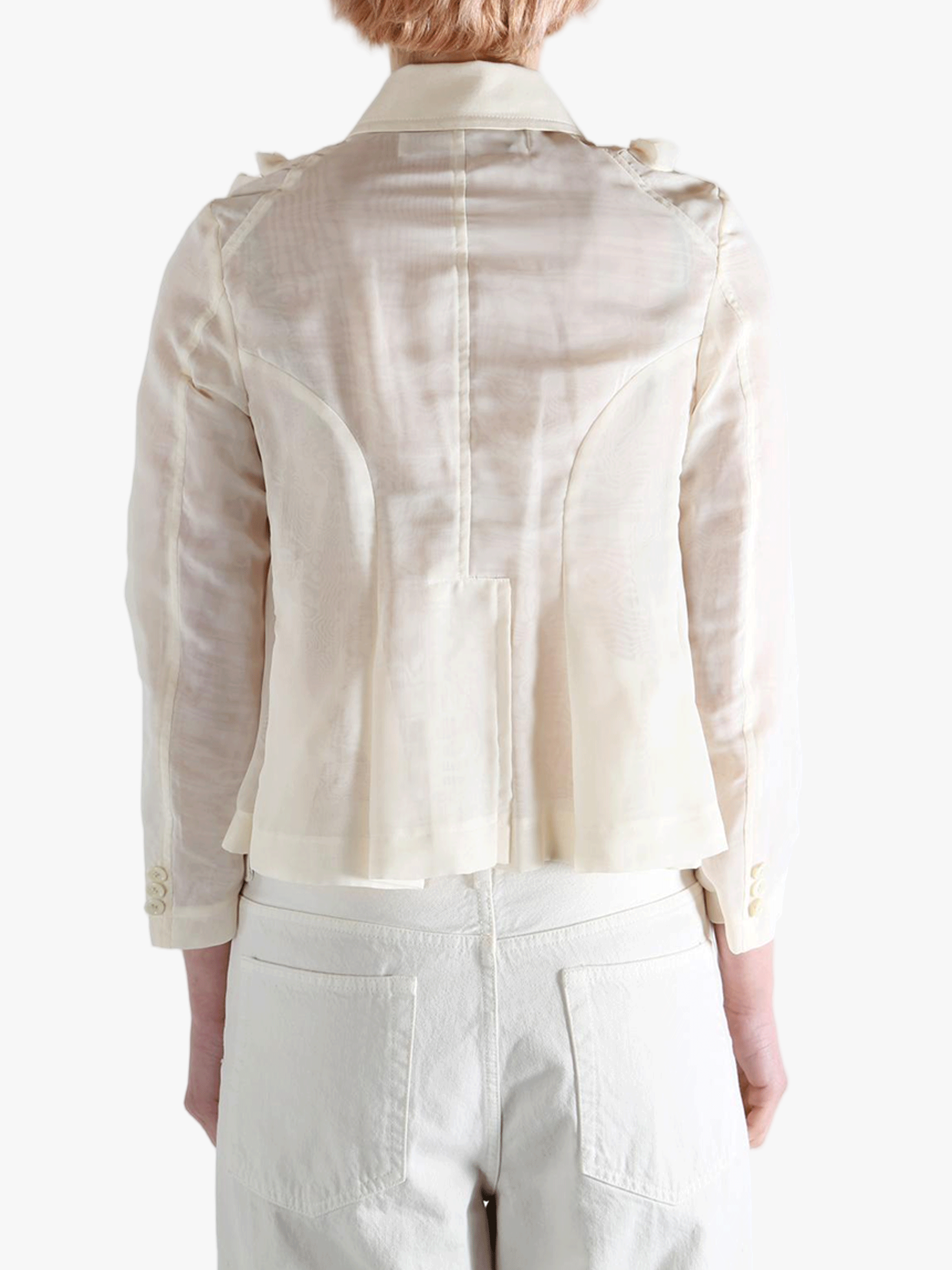 Tan jacket worn by a person, showing the jacket fit