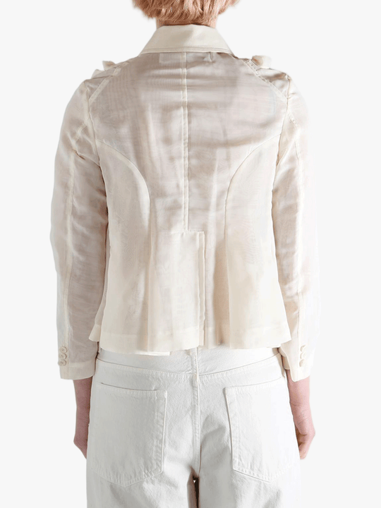 Tan jacket worn by a person, showing the jacket fit