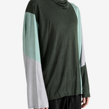Green hoodie worn by a person, showing the hoodie fit