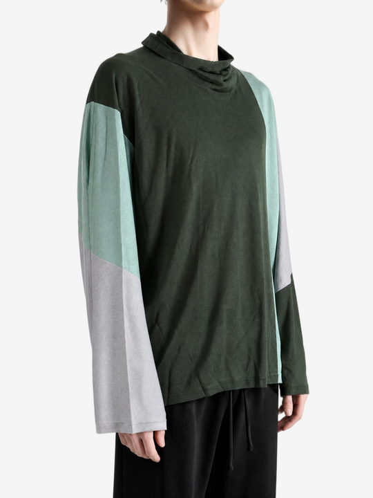 Green hoodie worn by a person, showing the hoodie fit