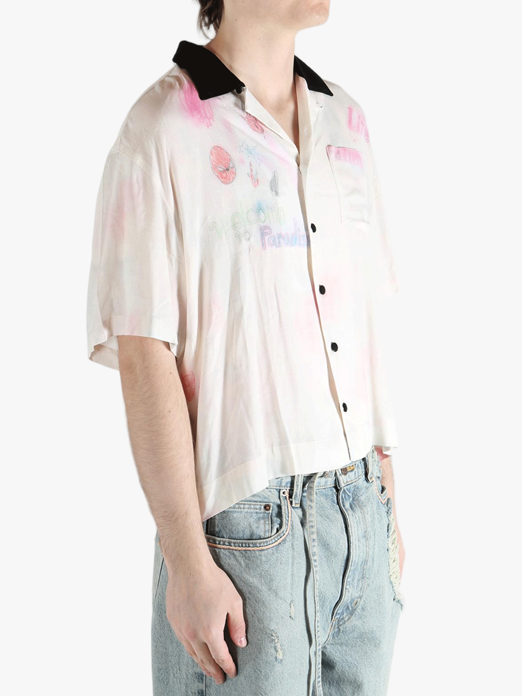 White shirt worn by a person, showing the shirt's fit