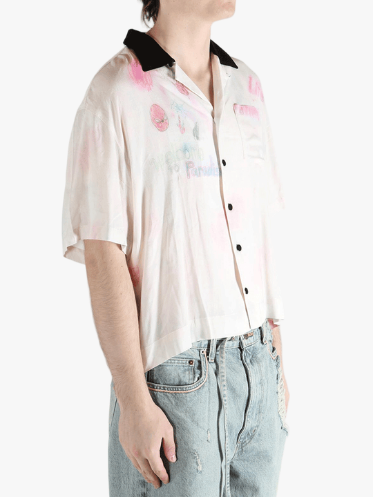 White shirt worn by a person, showing the shirt's fit
