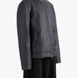 Grey jacket worn by a person, showing the jacket fit