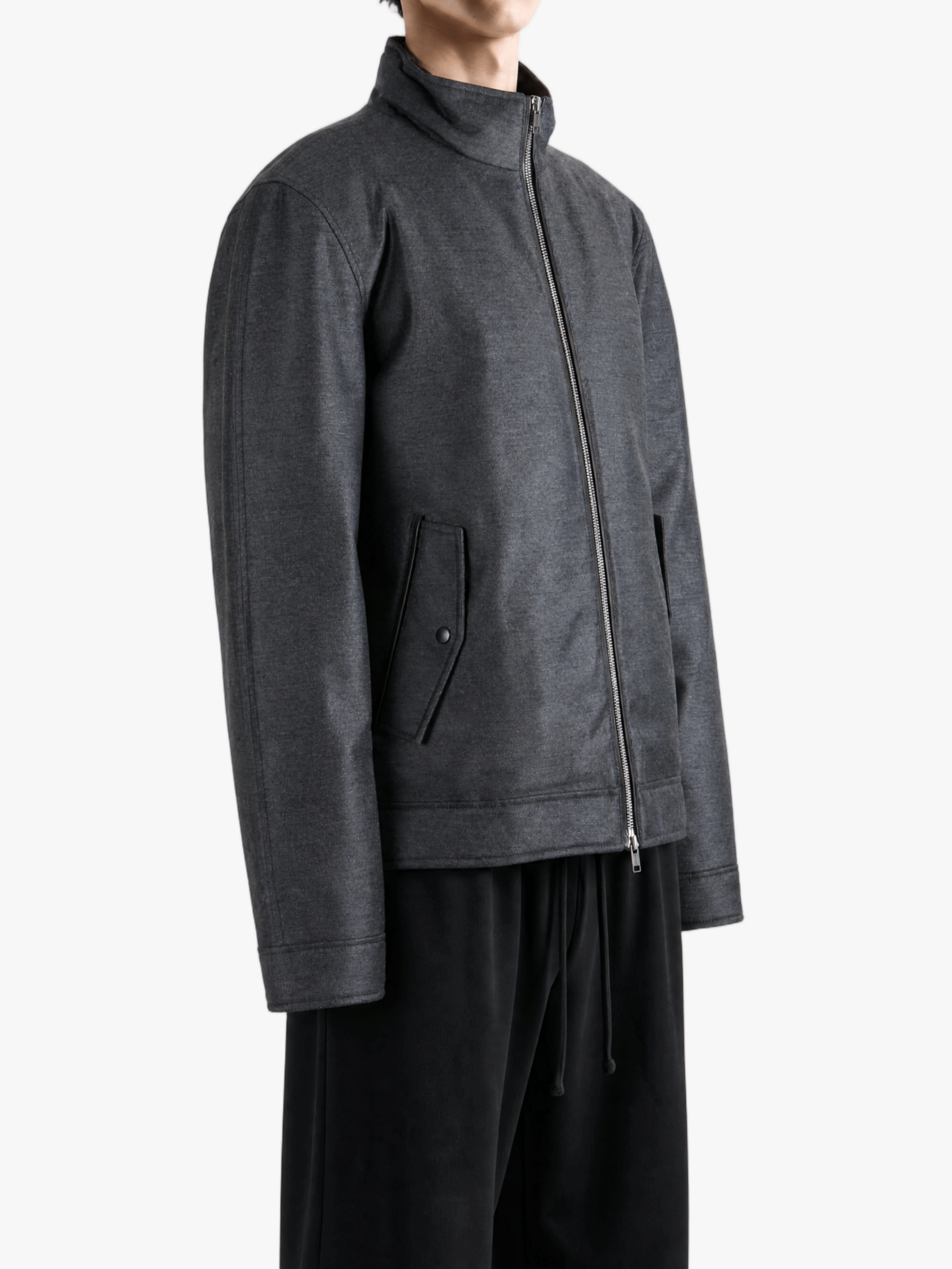 Grey jacket worn by a person, showing the jacket fit