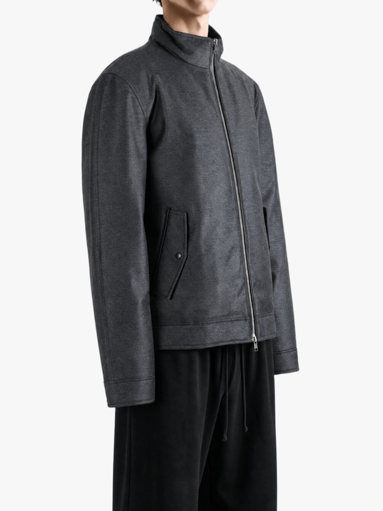 Grey jacket worn by a person, showing the jacket fit