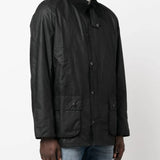 Black jacket worn by a person, showing the jacket's fit