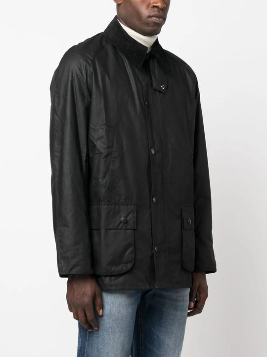 Black jacket worn by a person, showing the jacket's fit