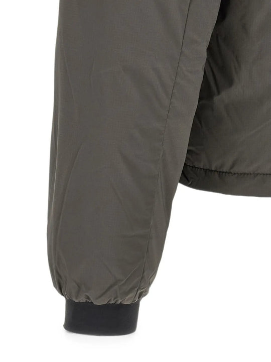 Close up of Grey jacket, showing texture of the 100% polyamide fabric