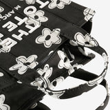 Close up of the black bag, showing texture of the cotton fabric