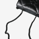 Close up of black bag, showing texture of the leather fabric