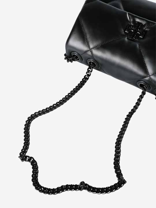 Close up of black bag, showing texture of the leather fabric