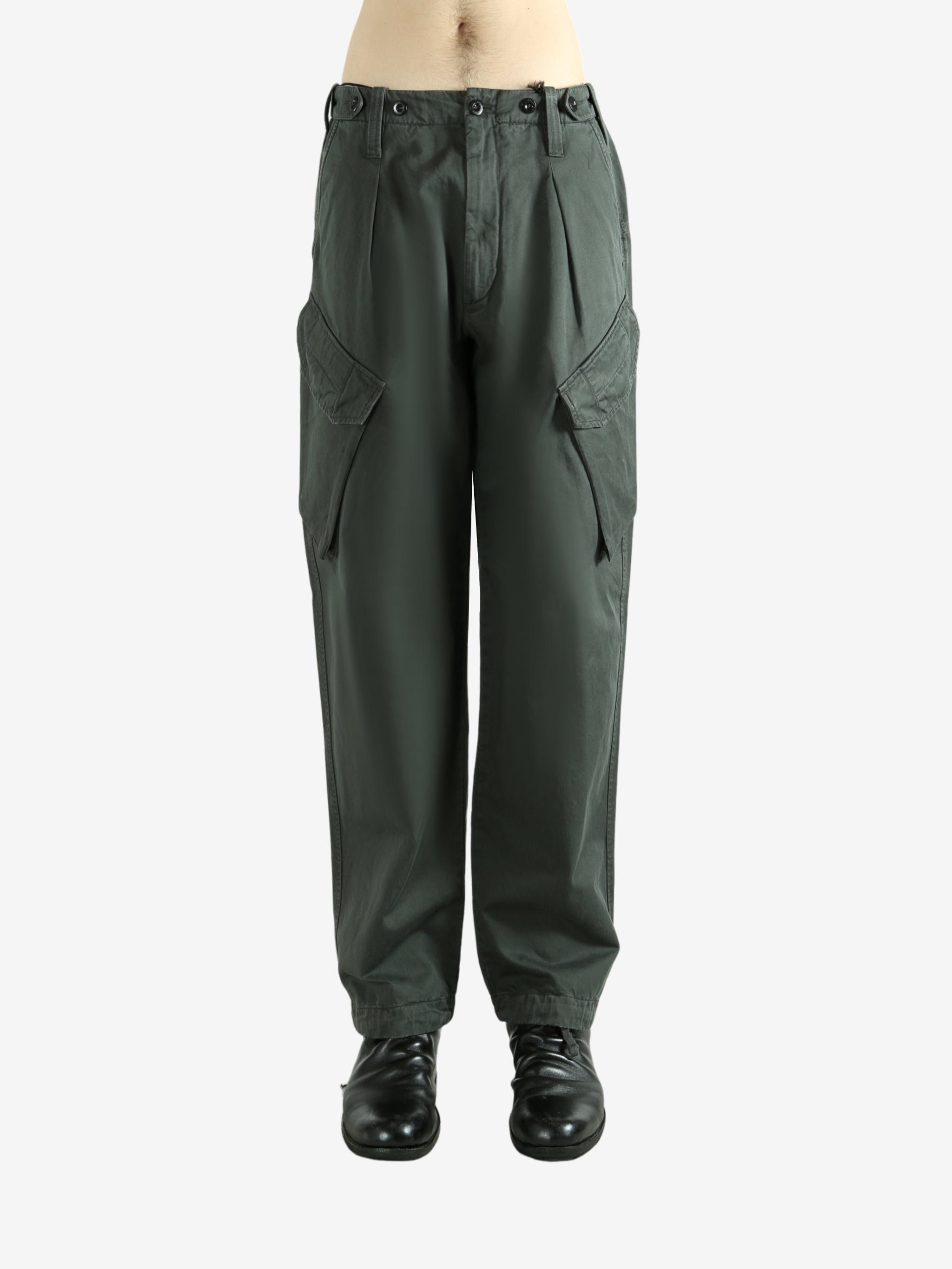 Green pants worn by a person, showing the pants fit