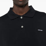 Navy shirt worn by a person, showing the shirt fit