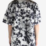 Black shirt worn by a person, showing the shirt's fit