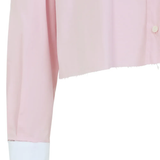 Close up of the pink shirt, showing texture of the cotton fabric