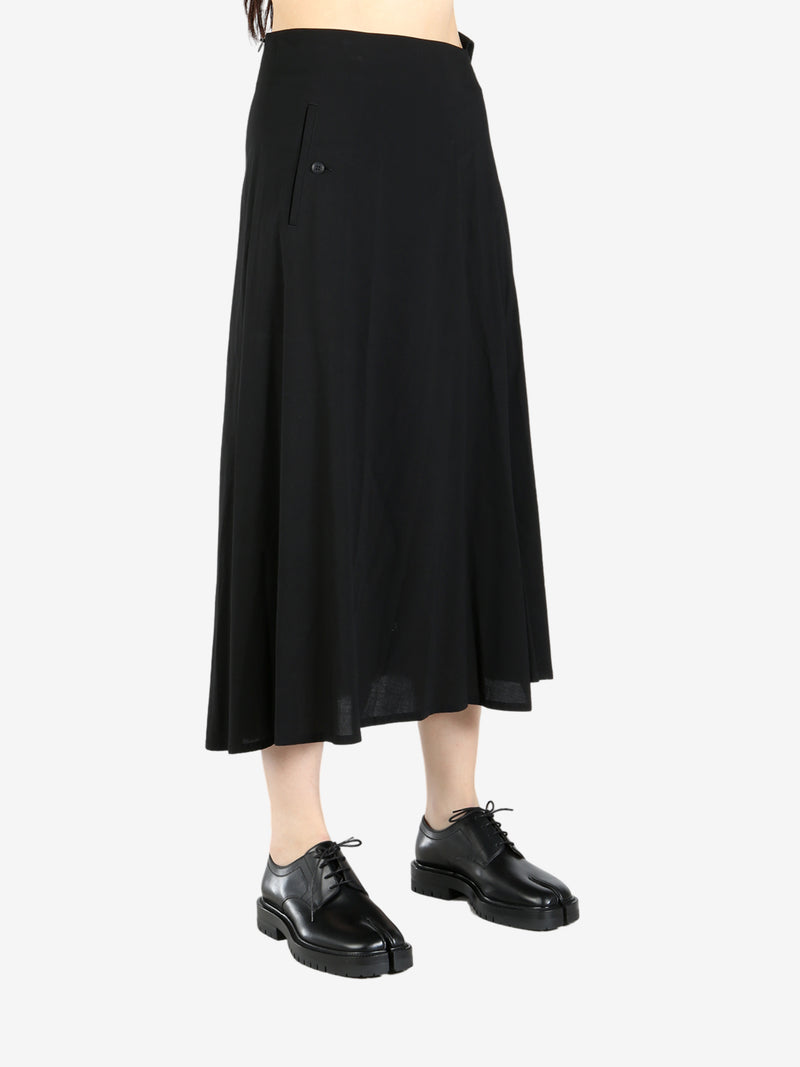 Black skirt worn by a person, showing the skirt’s fit