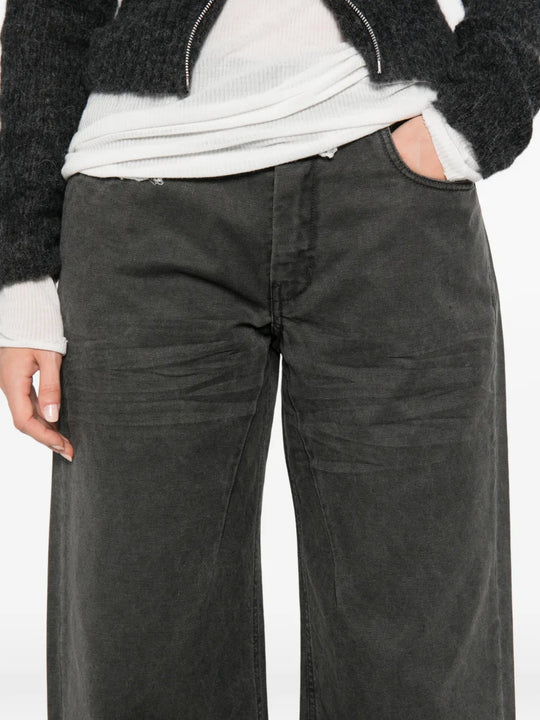 Grey pants worn by a person, showing the pants fit