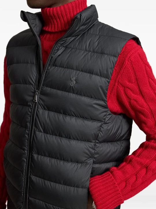 Black jacket worn by a person, showing the jacket fit