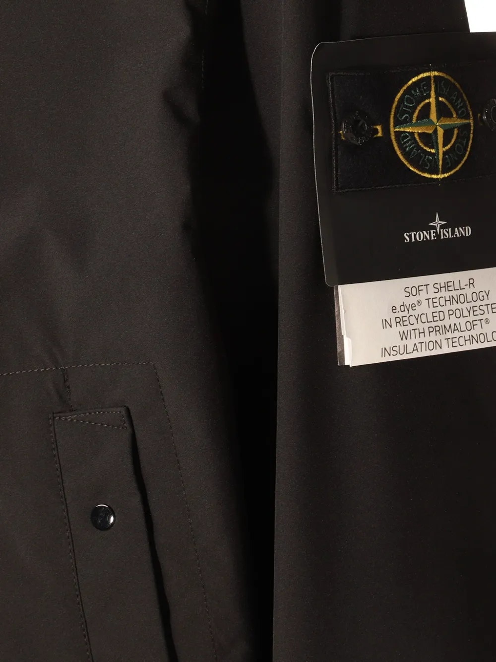 Close up of black coat, showing texture of the polyester fabric