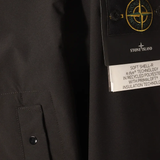 Close up of black coat, showing texture of the polyester fabric