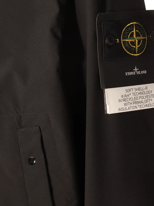 Close up of black coat, showing texture of the polyester fabric