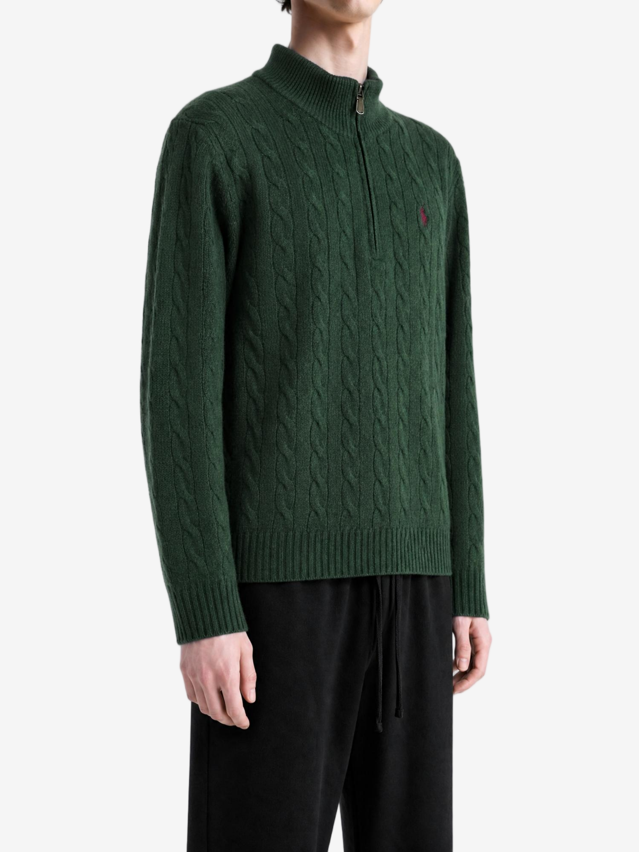 Green knitwear worn by a person, showing the knitwear fit