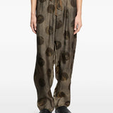 Grey pants worn by a person, showing the pants fit