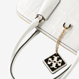 Close up of white bag, showing texture of the leather fabric