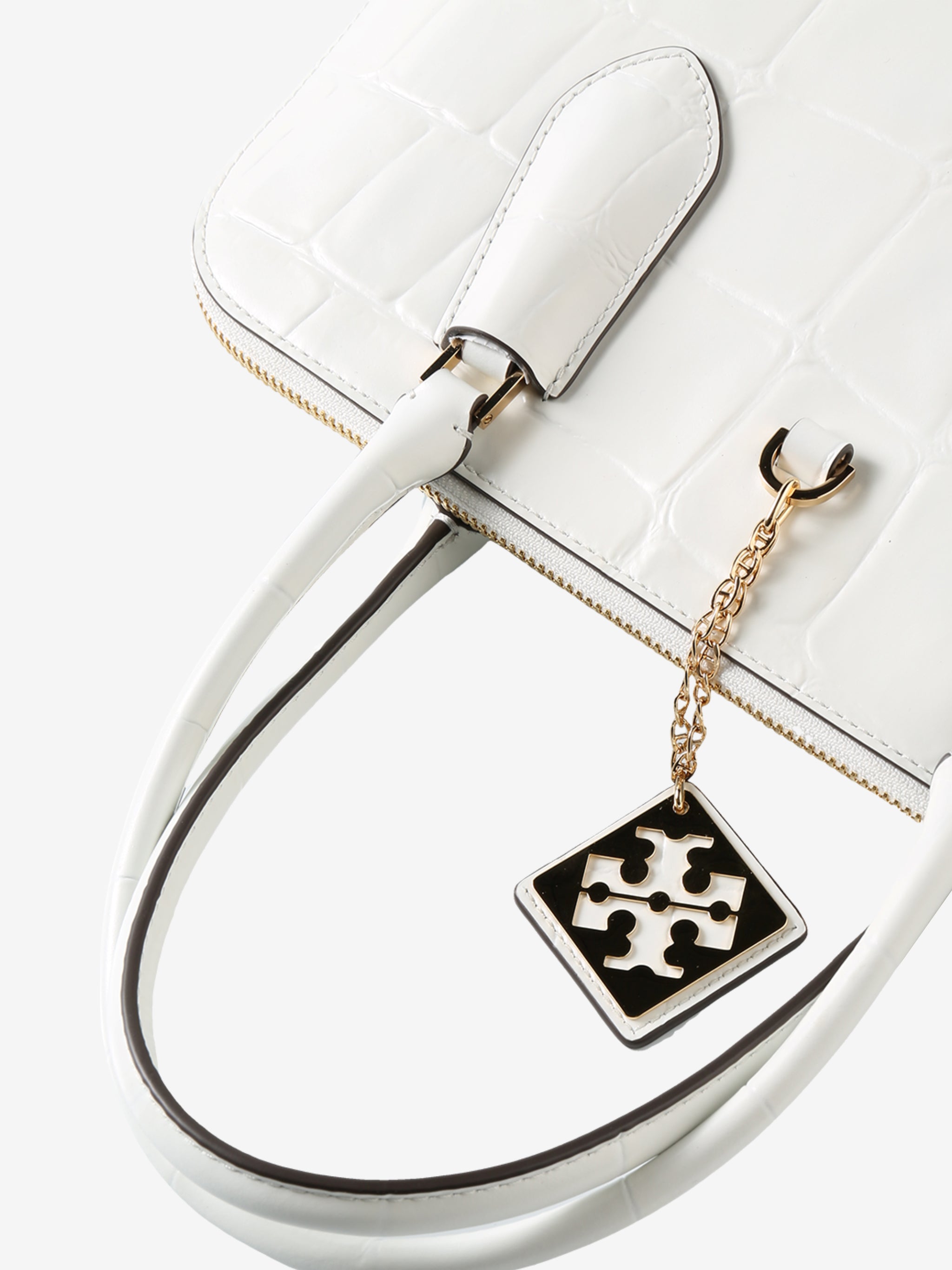 Close up of white bag, showing texture of the leather fabric