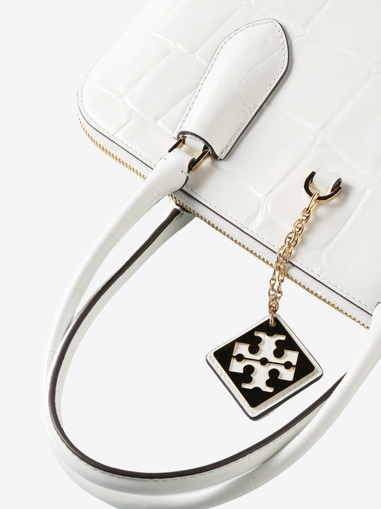 Close up of white bag, showing texture of the leather fabric