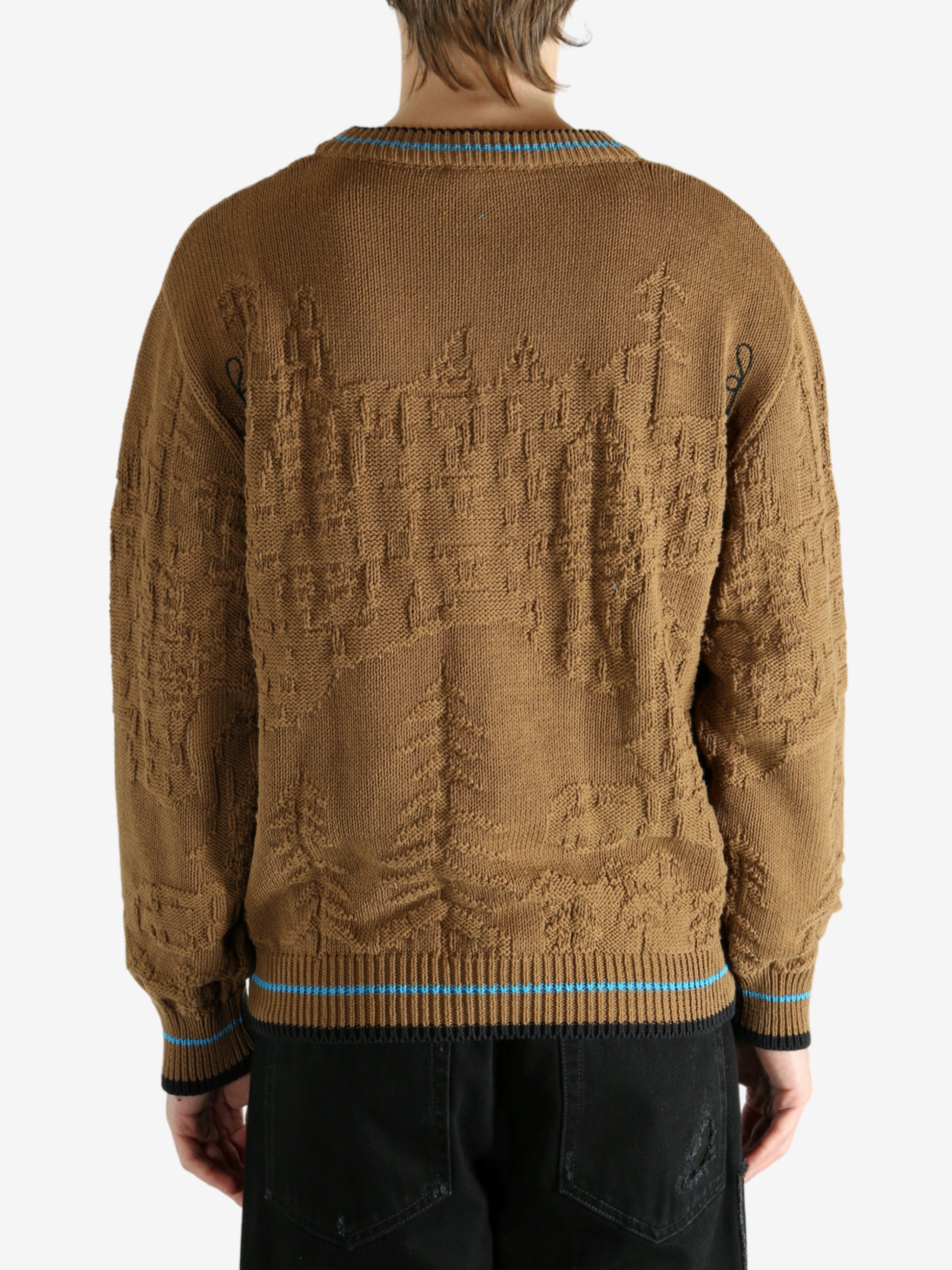 Brown jumper worn by a person, showing the jumper's fit