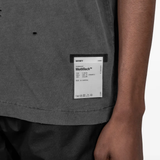 Grey t-shirt worn by a person, showing the t-shirt fit