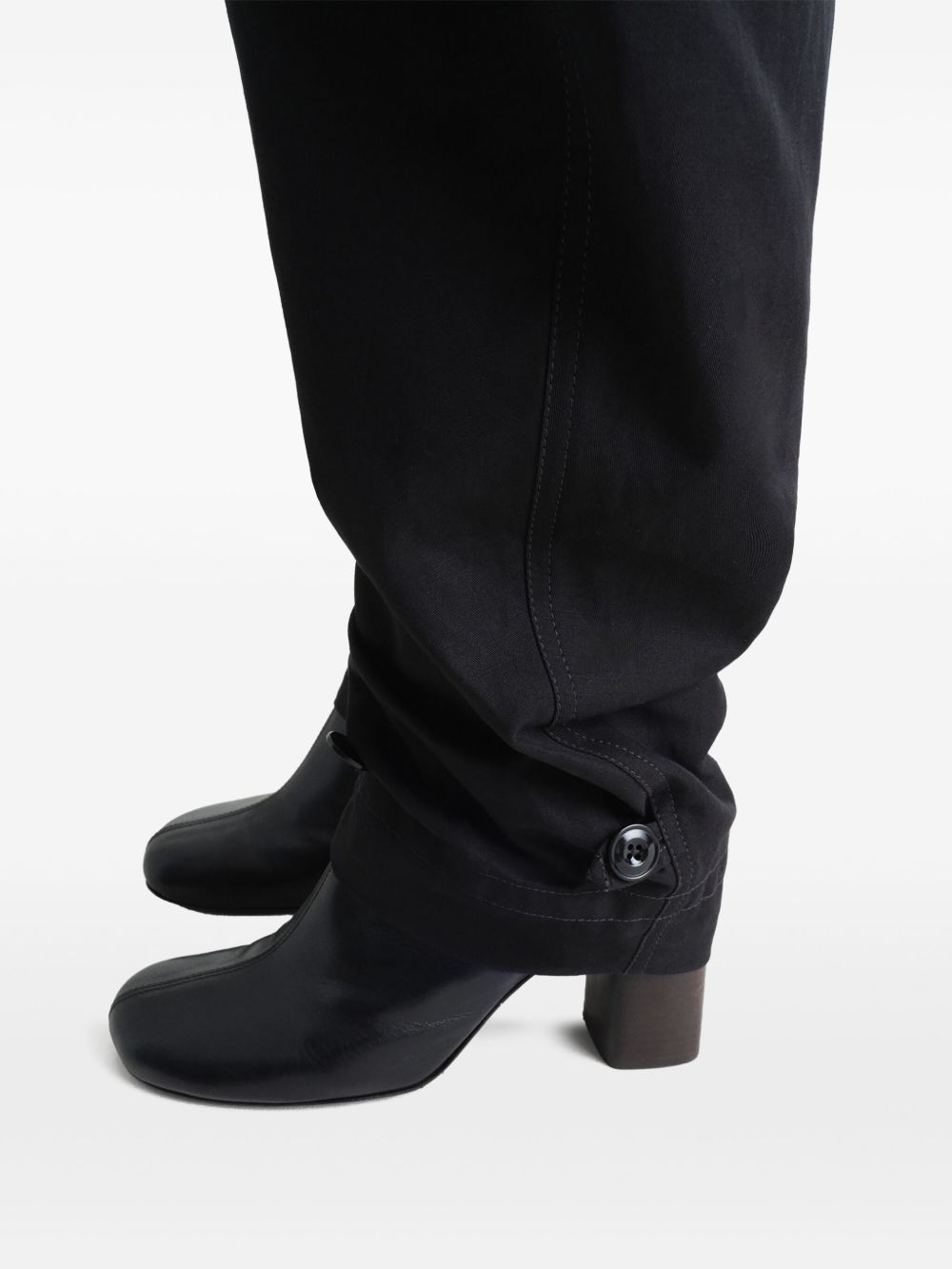 Close up of black pant, showing texture of the cotton fabric