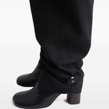 Close up of black pant, showing texture of the cotton fabric