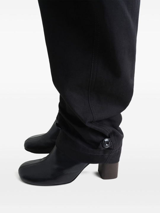 Close up of black pant, showing texture of the cotton fabric