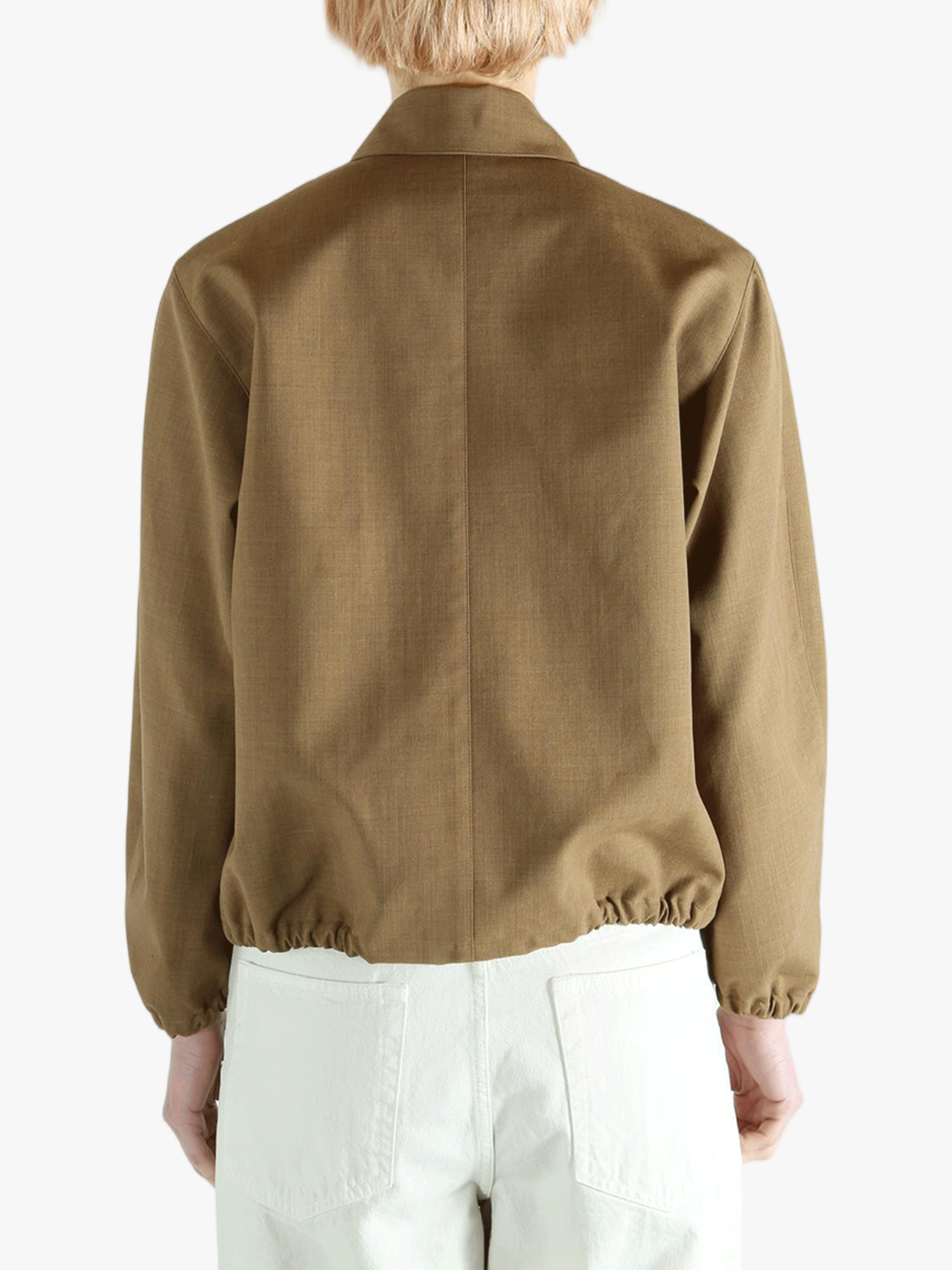 Brown jacket worn by a person, showing the jacket fit