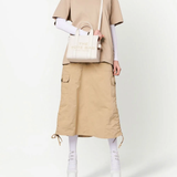 White bag worn by a person, showing the bag's fit