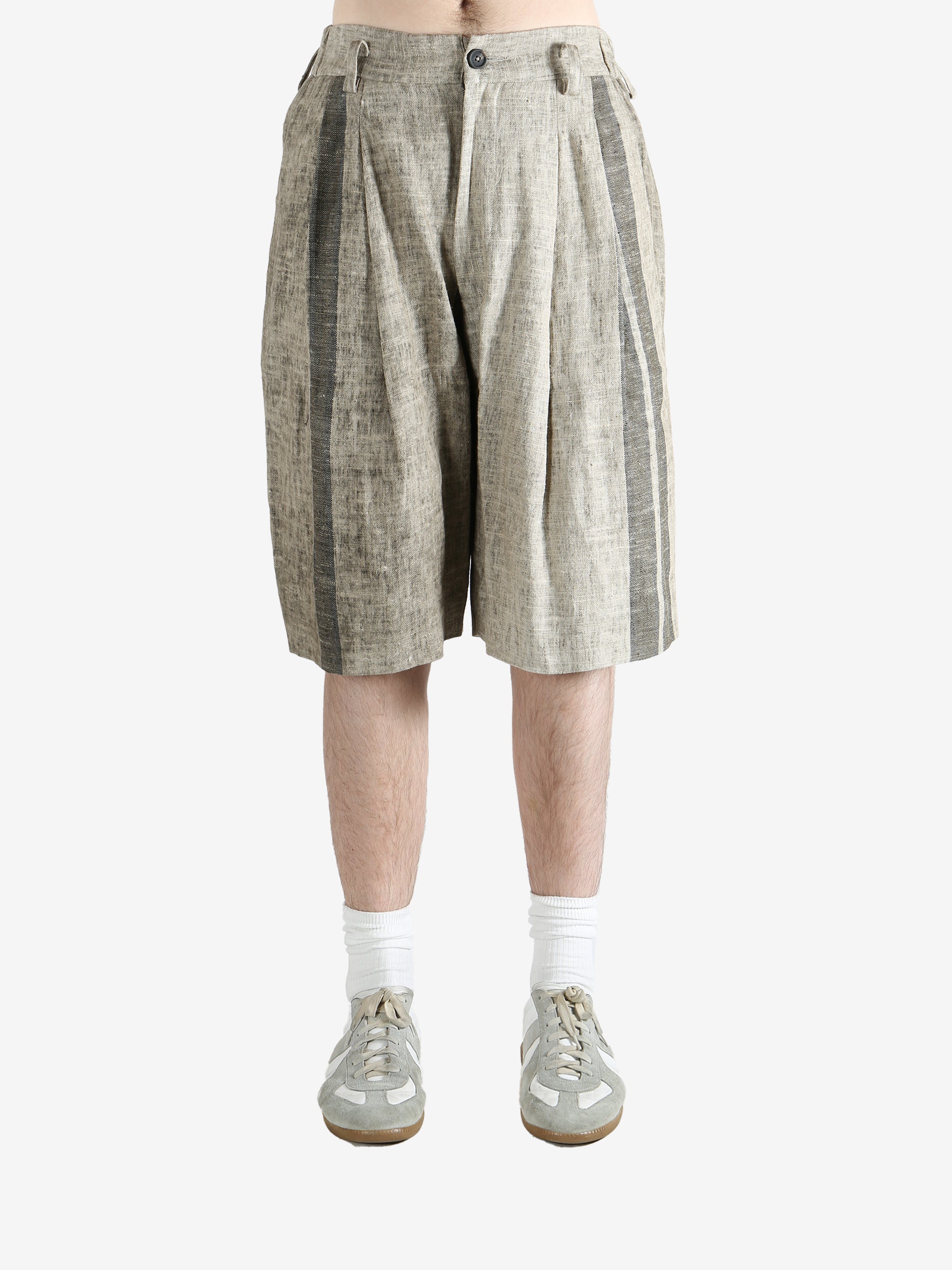 Grey shorts,worn by a person, showing the short's fit