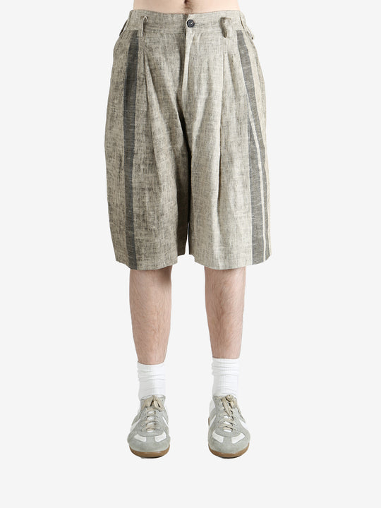 Grey shorts,worn by a person, showing the short's fit