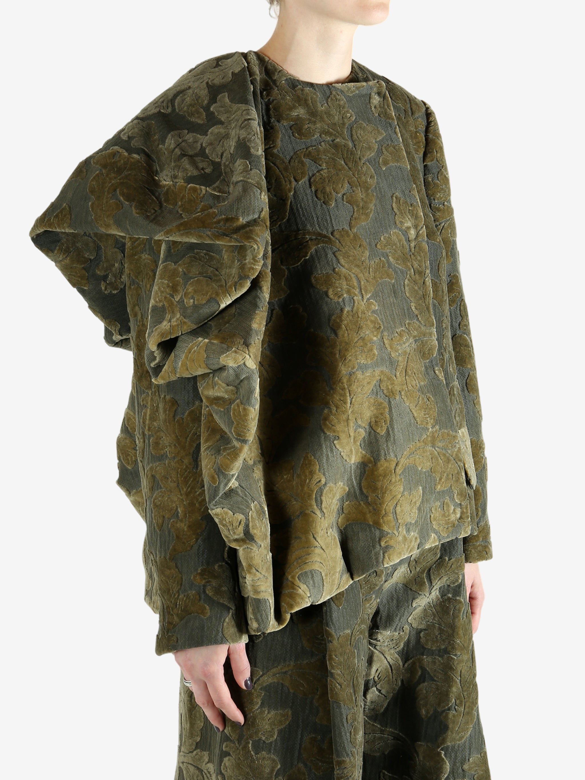 Grey jacket worn by a person, showing the jacket's fit