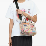 Pink bag worn by a person, showing the bag fit