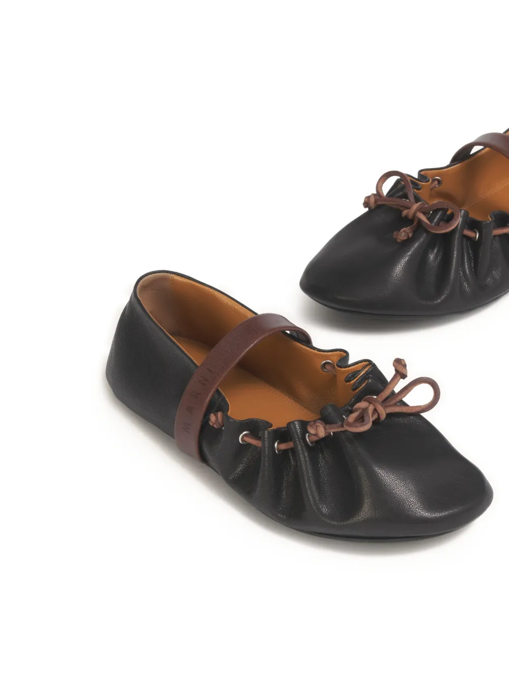 Close up of black flats, showing texture of the Calf Leather fabric