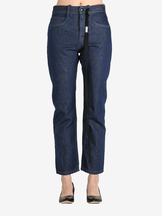 Dark blue pants worn by a person, showing the pants's fit