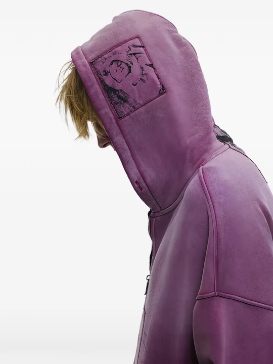 Purple hoodie worn by a person, showing the hoodie fit